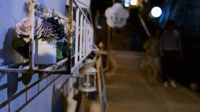 Night street with decorative flowers