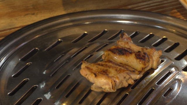 Chicken Pieces Being Cooked on a Barbeque Grill