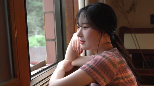 Woman looking out the window