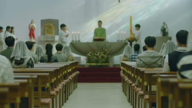 Priest and congregation celebrating mass in the cathedral