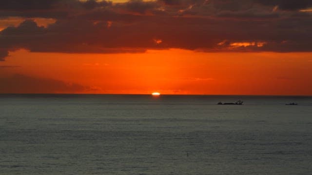 Sunset over the ocean with a vibrant sky