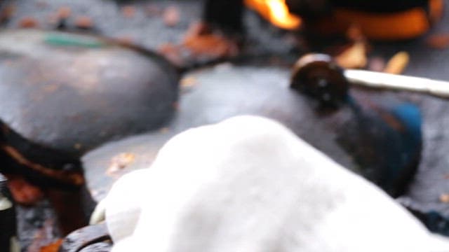 Fish-shaped pastry cooking on a hot pan