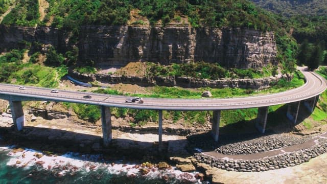 Coastal Highway with Vehicles and Scenic Views