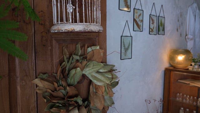 Artifacts and botanical display in a cozy room setting