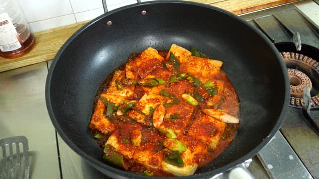 Spicy braised tofu cooked deliciously on a pan