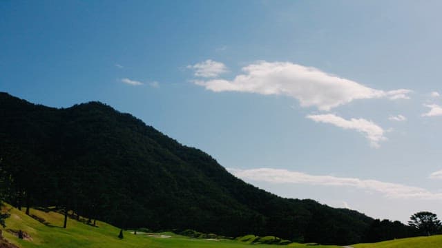 Serene Golf Course by Lush Mountainside