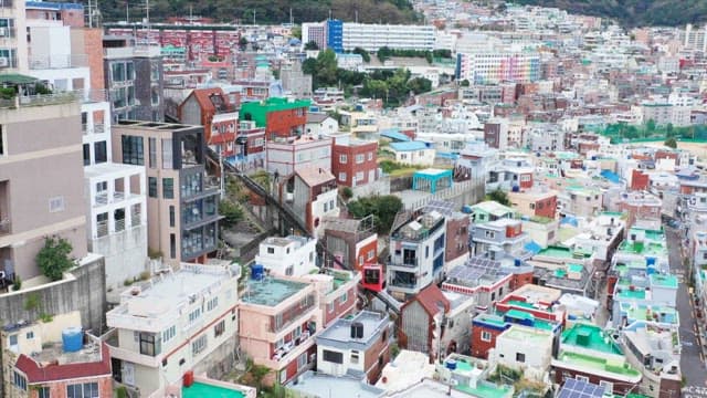 Monorail passing through the densely populated Choryang Story the Way