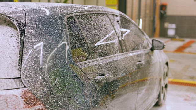 Soap Foam Sprayed on the Car for Car Washing