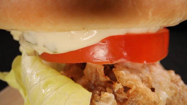 Hamburger with fried pork, tomato and garlic mayonnaise sauce