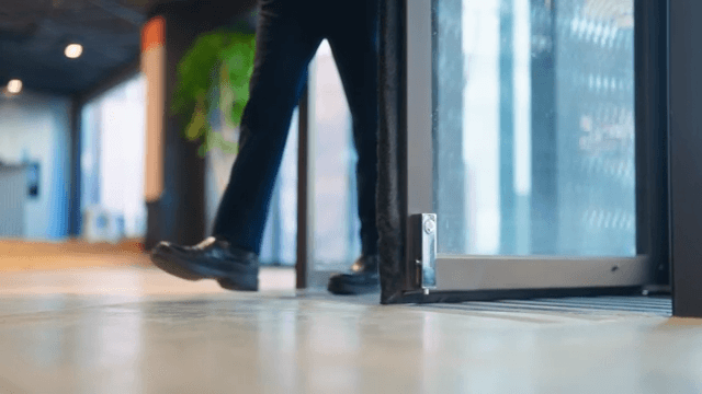 Person coming through revolving door