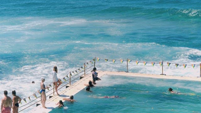Seaside Pool Enjoyed by Swimmers and Spectators
