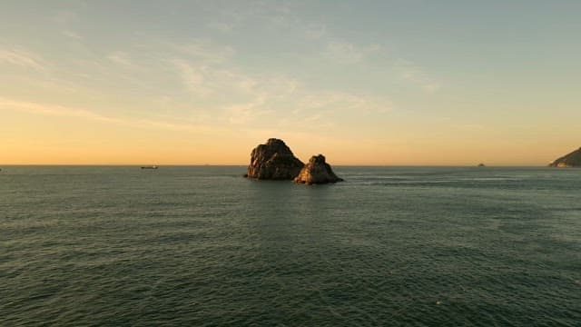 Beautiful sunset view of the island over the vast sea