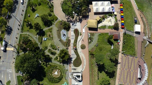 View of the park full of green and colorful structures on a sunny day