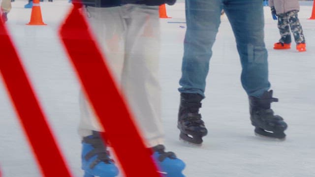 People ice skating on a rink