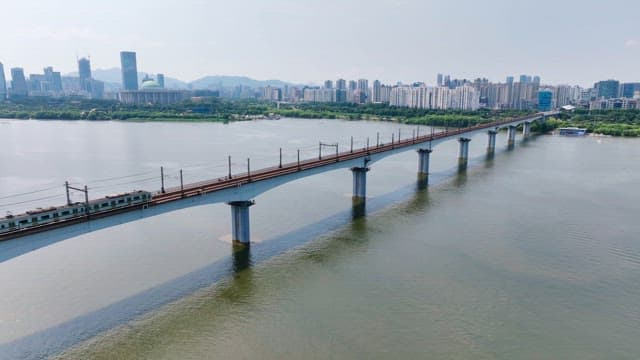 Subway crossing a bridge over a river