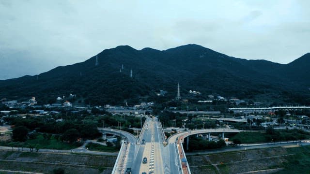 Road view on a cloudy day with mountains in the distance