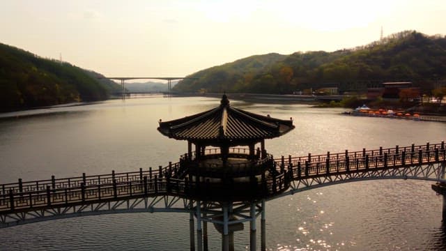 Traditional pavilion over a serene river