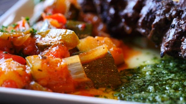 Plate of deliciously plated steak and vegetables