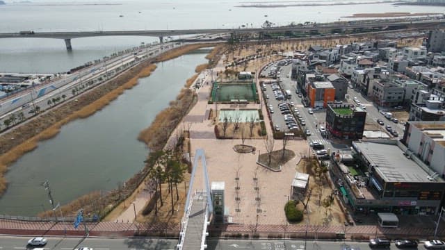 Riverside park with nearby urban area