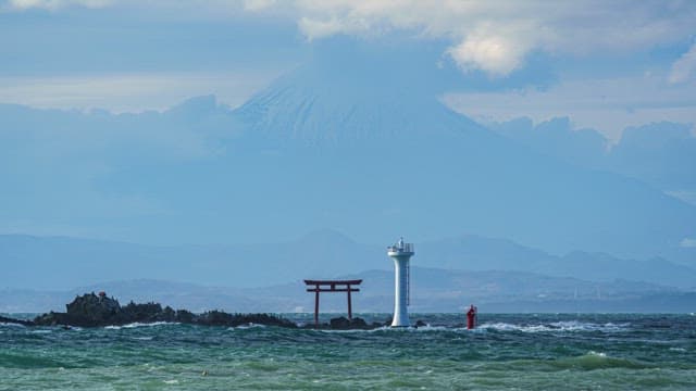 Lighthouse and clouds on the sea