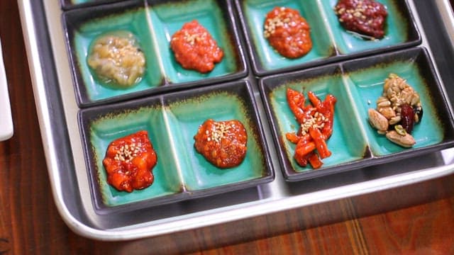 Various Korean salted seafood dishes on a tray