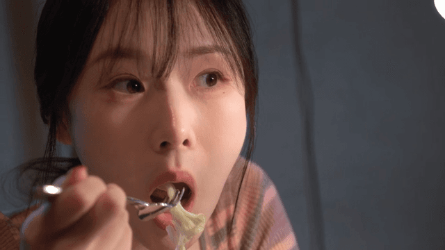 Woman enjoying a meal indoors