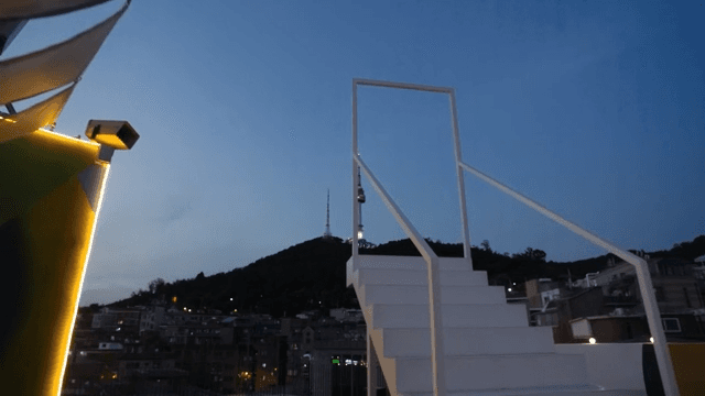 City view from rooftop with white stairs