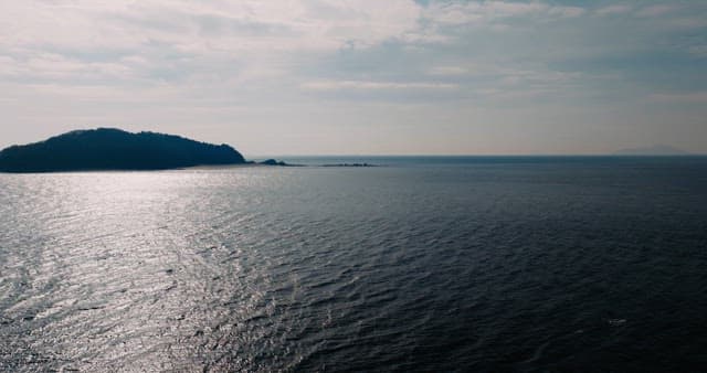 Beach with Distant Hills Beyond the Sea