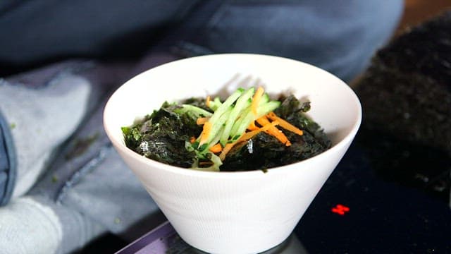 Delicious chewy noodles topped with kimchi and laver