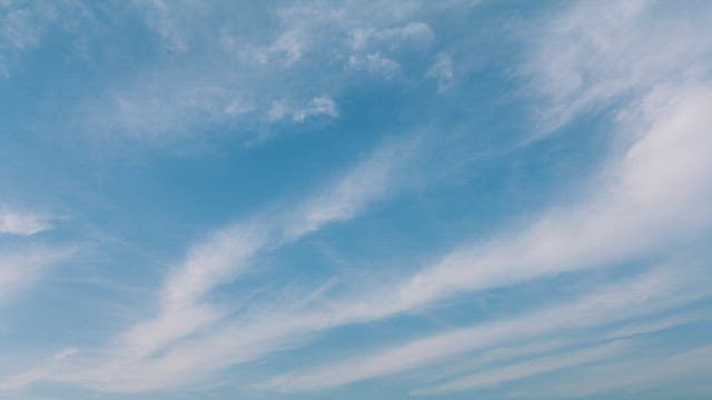 Serene Blue Sky with Wispy Clouds