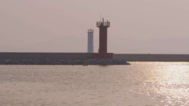 Serene Sunset at the Coastal Lighthouse