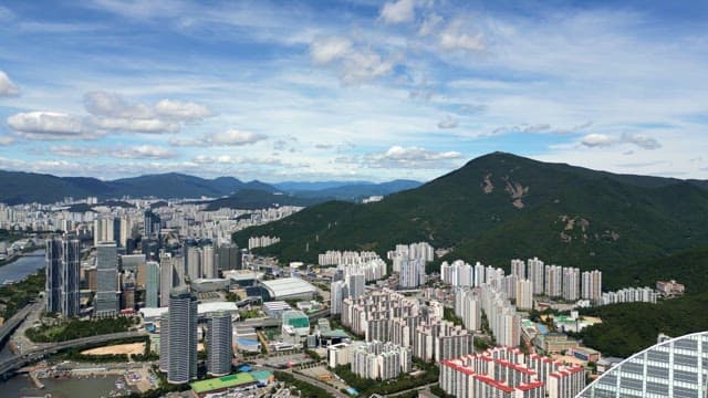 Sprawling cityscape with mountains