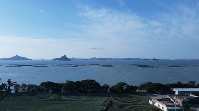 Coastal View with Aquaculture and Farm Landscape