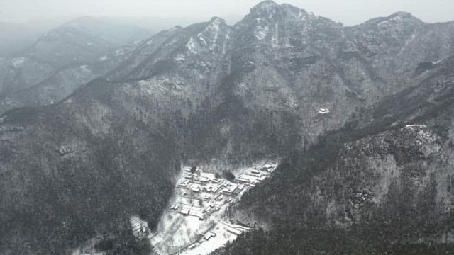 Temple located in the middle of a snow-covered mountain
