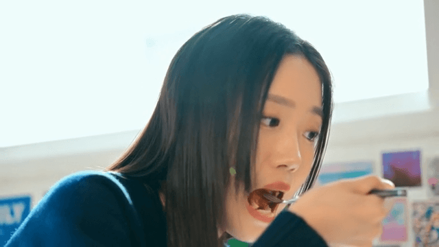 Young woman enjoying pizza indoors