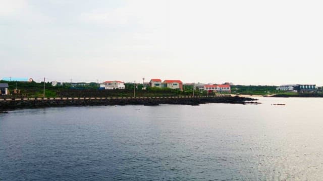Scenic coastal view with houses along the shoreline
