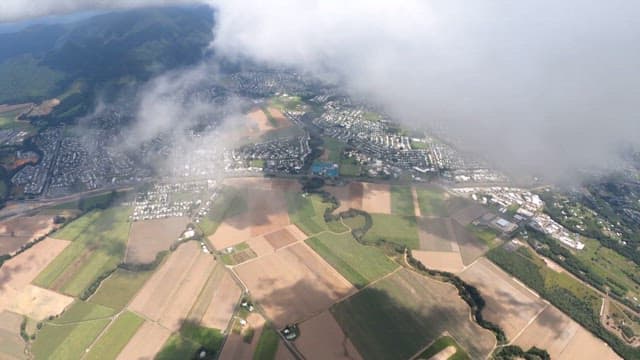 View of skydiver descending with a parachute