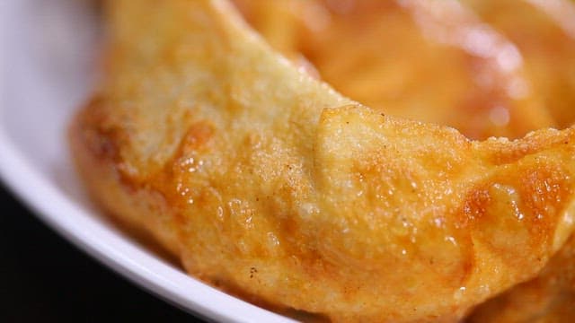 Crispy golden fried dumplings on a plate