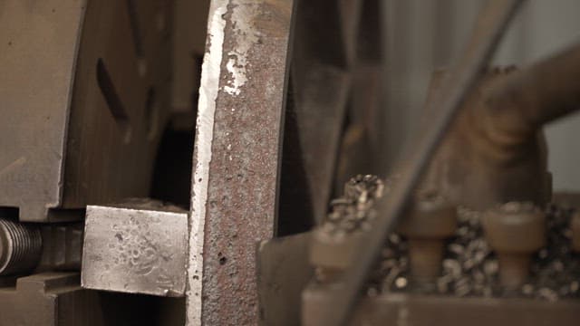 Worker operating a metal machine