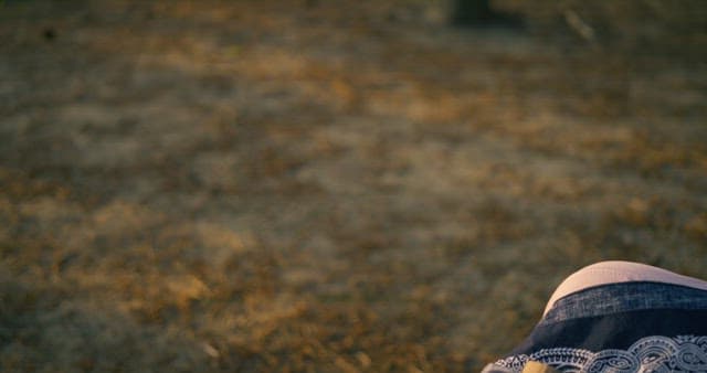 Crafting with Wooden Sticks at Sunset