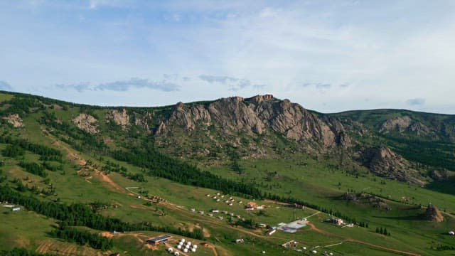 Vast landscape with mountains and greenery