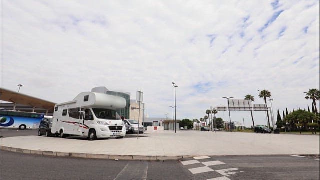 Recreational Vehicles Parked at a Public Area on Sunny Day