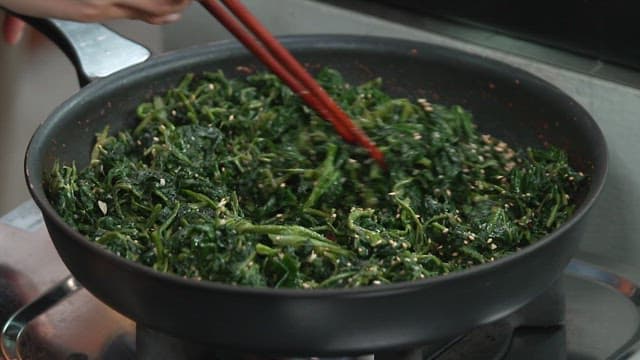 Stir-frying Korean Thistle in a Frying Pan