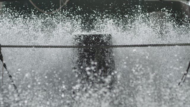 Rushing Stream of Water and Splashing Droplets