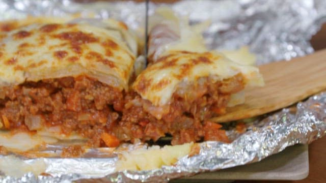 Chou Farci with beef being served on a plate