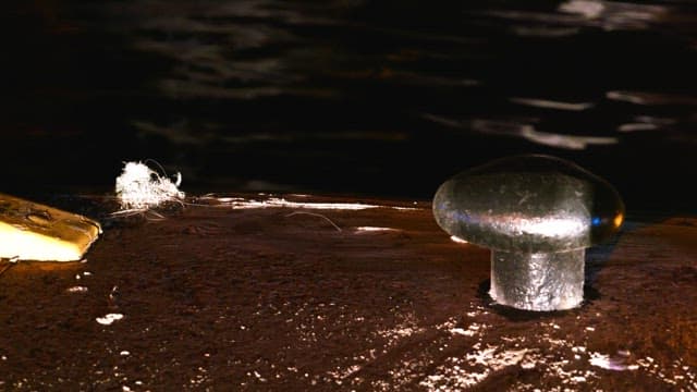 Dock at night illuminated by light