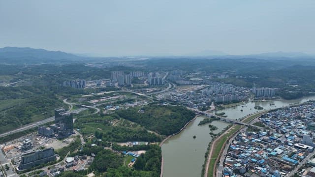Sprawling city with surrounding nature