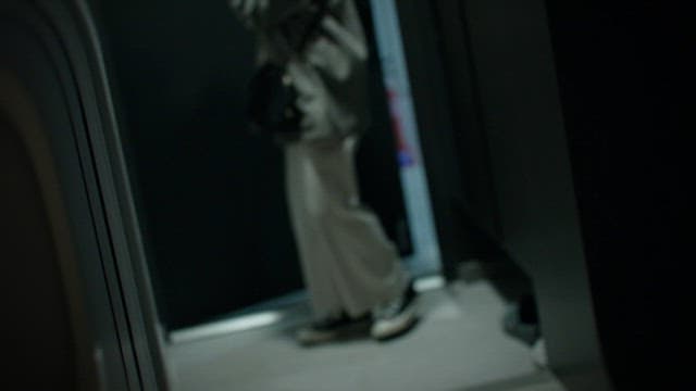 Mysterious Man Blocks a Woman Entering a Dark House