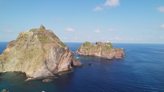 Rocky island surrounded by blue ocean