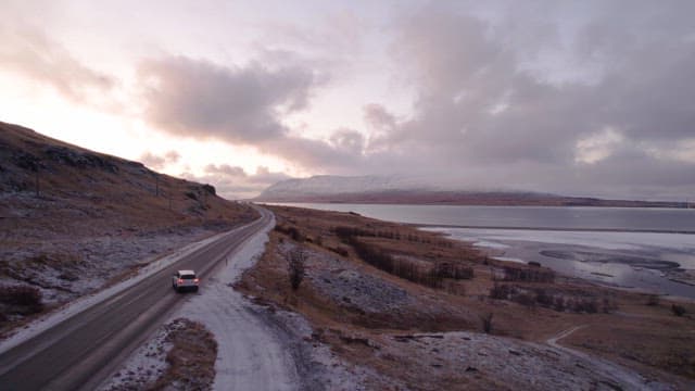 Car driving on a coastal road